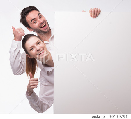 Young happy couple showing presentation pointing 30139791