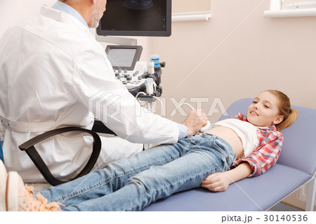 Charming child enjoying ultrasonic abdomen Charming child enjoying ultrasonic abdomen 30140536