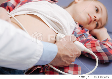 Thoughtful teenager getting organism ultrasonic 30140585