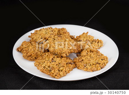 Plate with oatmeal cookies. 30140750