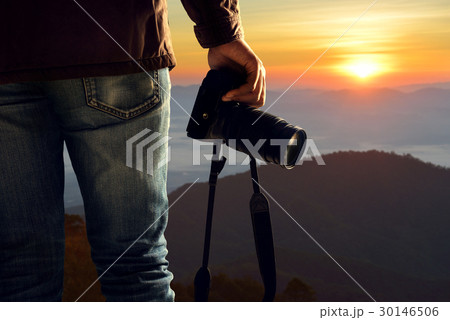 Hand of a man holding a camera 30146506