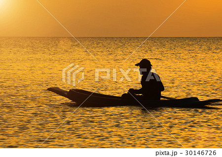 silhouette of fishermen in a boat. 30146726