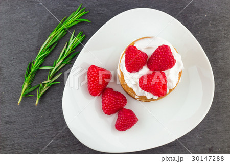 Fresh Red Raspberries on a white artistic plate 30147288
