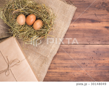 Rural eco background with brown chicken eggs, gift Rural eco background with brown chicken eggs, gift 30148049