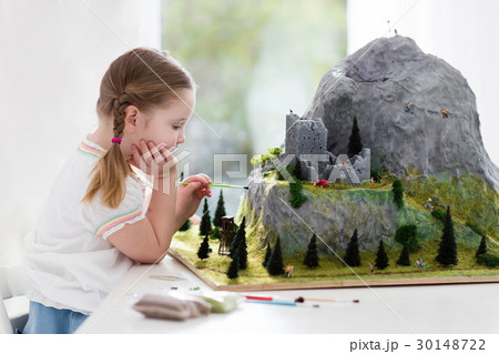 Kids working on model building project for school 30148722