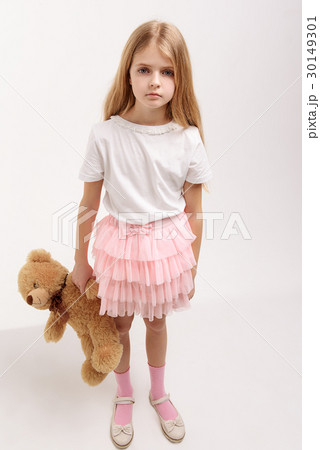 Serious small kid keeping toy 30149301