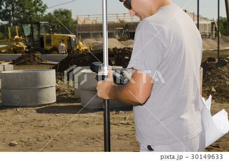Geodesist at a new build stadium in a village Geodesist at a new build stadium in a village 30149633