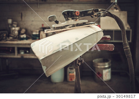 Classic car bodykit parts in painting workshop. 30149817