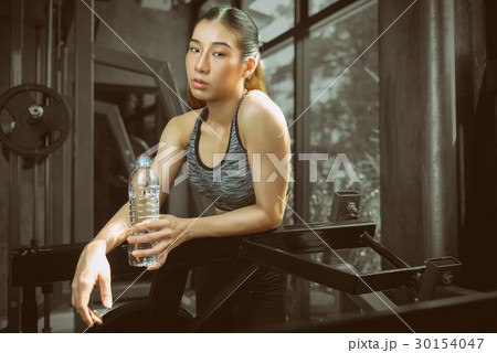 women exercising at Fitness center. 30154047