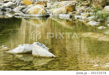 Rocky bottom of brook close-up as background. 30155078