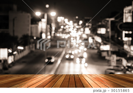 Wooden plank and blur cars traffic on urban 30155865