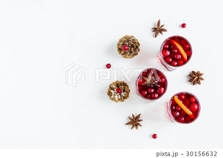 Mulled wine in small glasses with cranberries 30156632