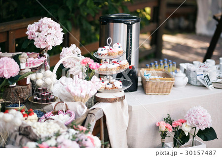 Dessert table for a party. Ombre cake, cupcakes 30157487