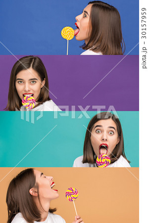 young woman with the colorful lollipop at studio 30157959