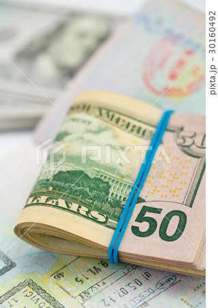 American money is on the top of the passport 30160492
