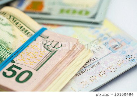 American money is on the top of the passport American money is on the top of the passport 30160494