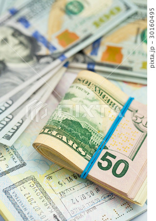 American money is on the top of the passport American money is on the top of the passport 30160495