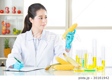 scientist looking the tube and recording science scientist looking the tube and recording science 30161942