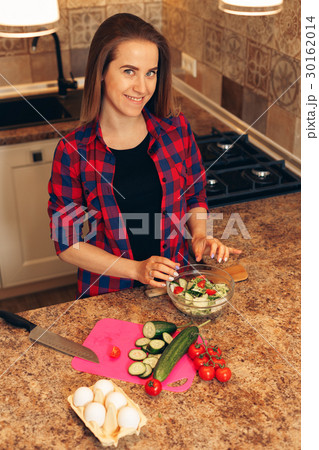 Top view woman making breakfast in the kitchen 30162014