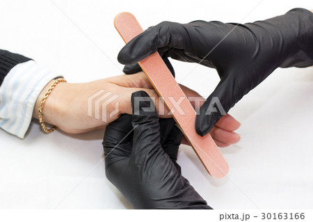 Woman doing manicure beauty salon  30163166