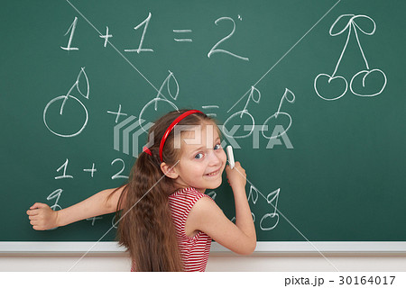 girl drawing on school board, education concept 30164017
