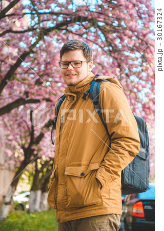 portrait of the yang man in glasses with blooming 30167324