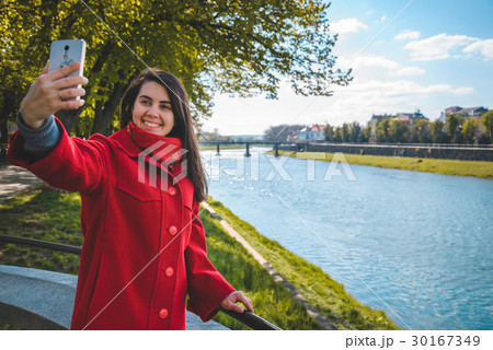 woman talking on the phone while walking 30167349
