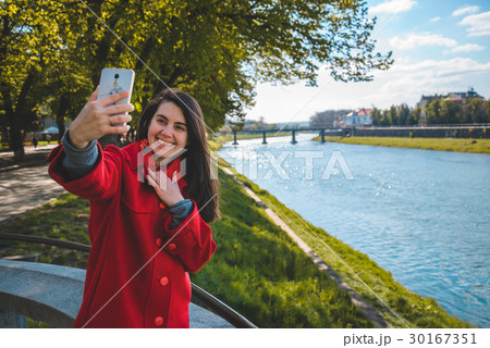 woman talking on the phone while walking 30167351