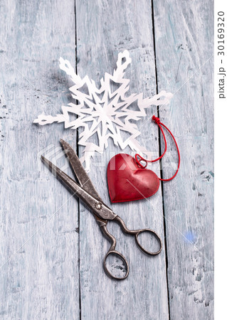 Vintage scissors, handmade paper snowflake and 30169320