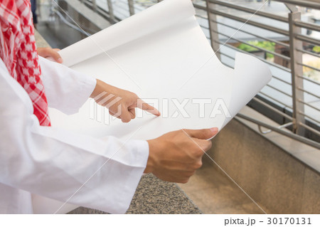 Arab Middle Eastern Businessman pointing paper Arab Middle Eastern Businessman pointing paper 30170131