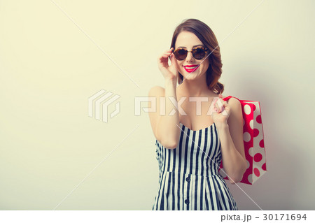young woman with shopping bag  30171694