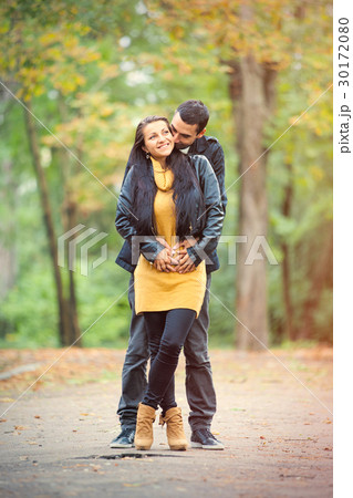photo of cute couple hugging and smiling 30172080