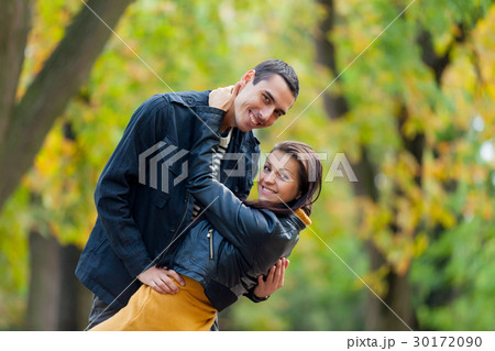 photo of cute couple hugging and smiling 30172090