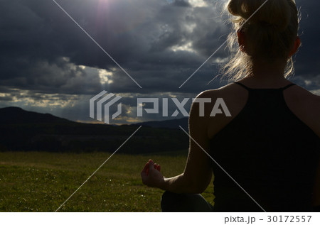 Woman Meditating in the Evening 30172557