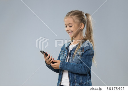 Little Teenage Girl Using Cell Smart Phone, Small Little Teenage Girl Using Cell Smart Phone, Small 30173495