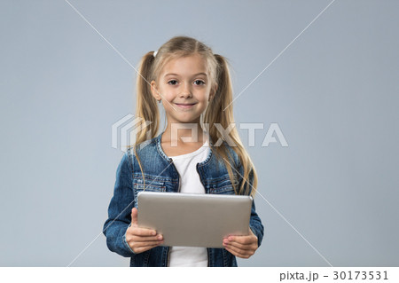 Little Teenage Girl Using Tablet Computer, Small 30173531
