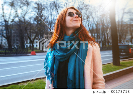 Red haired beautiful stylish girl is walking in Red haired beautiful stylish girl is walking in 30173718