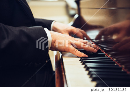 Professional musician pianist hands on piano keys Professional musician pianist hands on piano keys 30181185