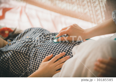 woman during pregnancy or shortly after childbirth 30185585