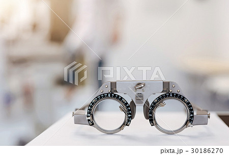 Neat ophthalmologist getting ready for appointment 30186270