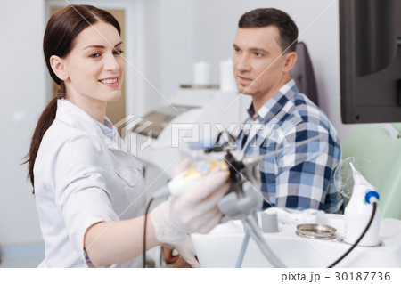 Positive delighted otolaryngologist taking 30187736