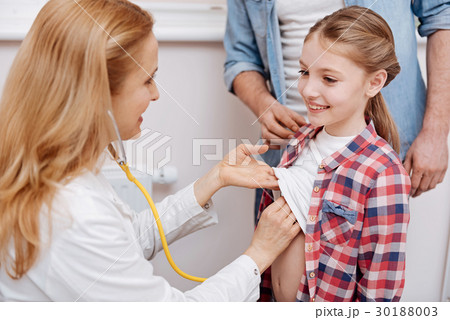 Smiling girl came for appointment with doctor 30188003