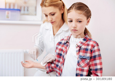 Sad girl standing on the foreground 30189180
