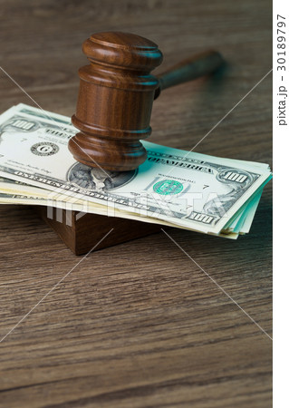 Photo of hammer with dollars 30189797