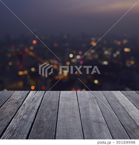Empty old wood floor over blurred light city tower Empty old wood floor over blurred light city tower 30189996