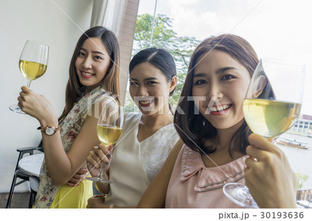 A photo of ladies enjoying holiday with champagne in restaurant 30193636