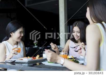 Ladies are enjoying lunch in a nice restaurant 30193643