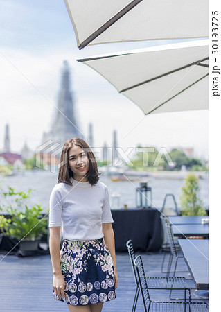 A photo of young and pretty girl with temple background 30193726