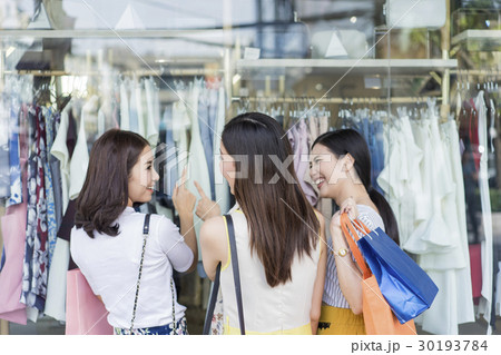 A group of women window shopping in shopping mall. A group of women window shopping in shopping mall. 30193784