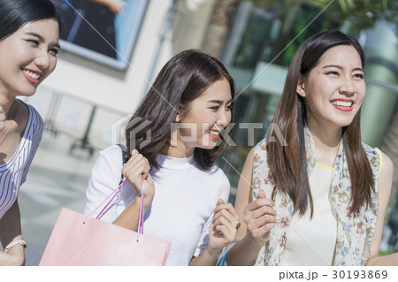 A portrait of three pretty ladies shine in the morning. 30193869